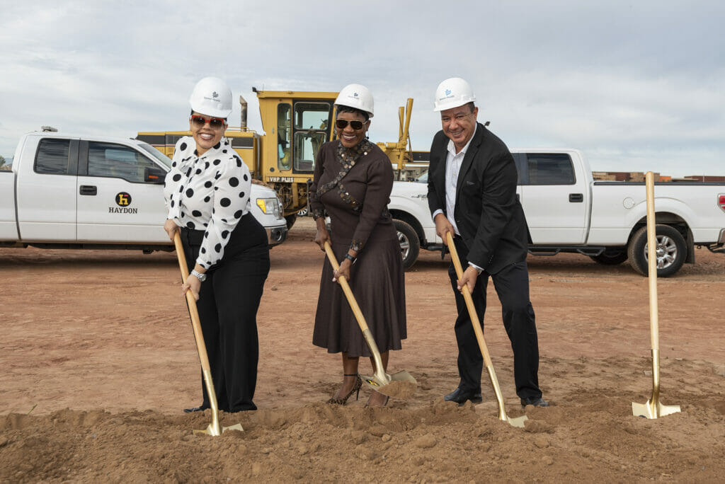 3 NexCore Members posing with a shovel at the new site for Banner Health Center