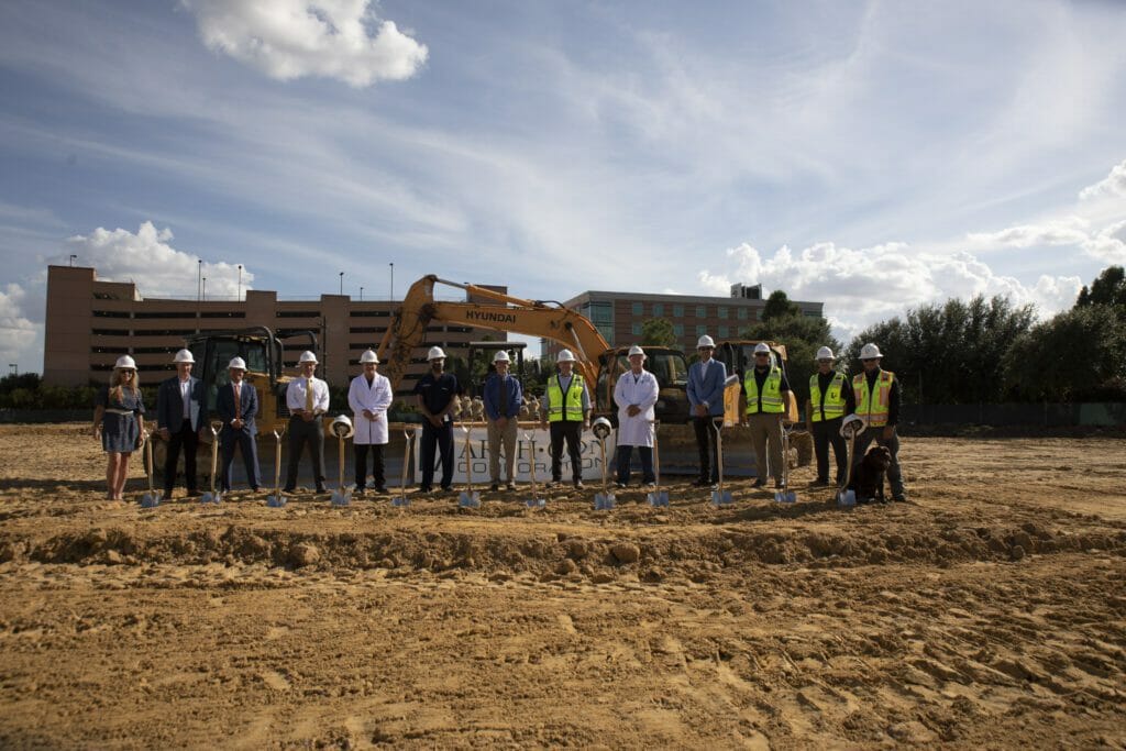 North Cypress ground breaking featuring a group posing with shovels.