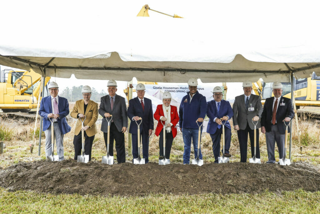 Gisela Houseman Medical Campus ground breaking featuring a group posing with shovels.
