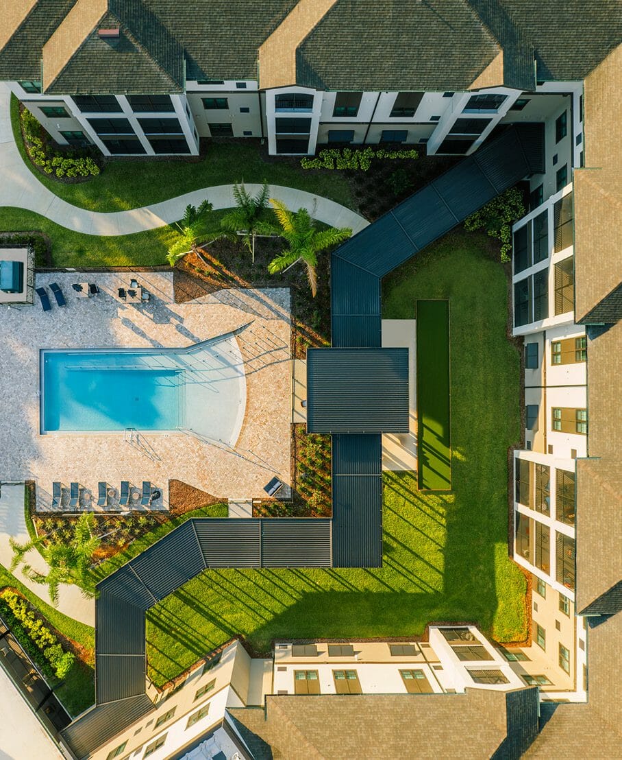 Drone image over pool and outdoor patio space at Sancerre at Orange City