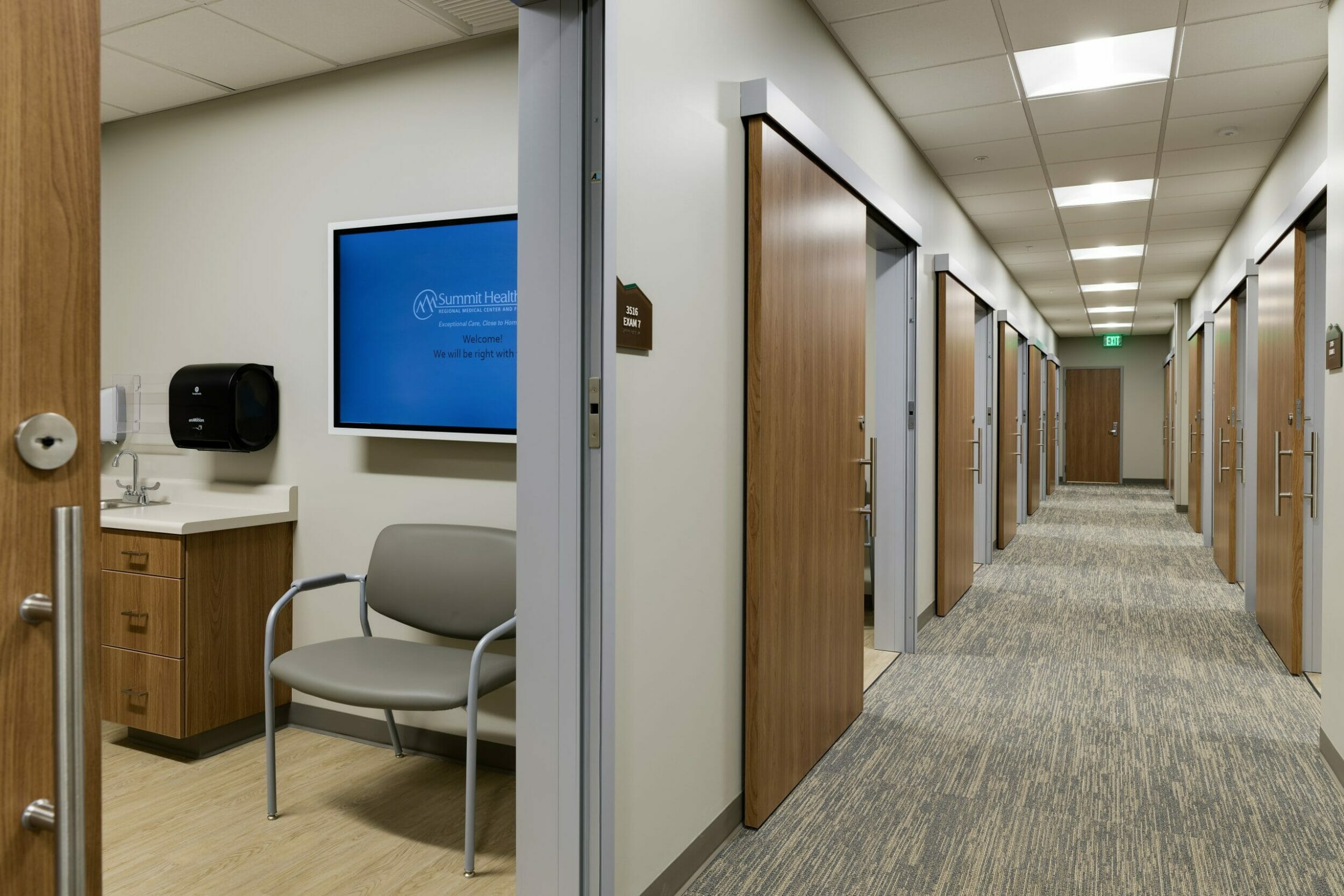 patient exam room, sliding door open to care team area