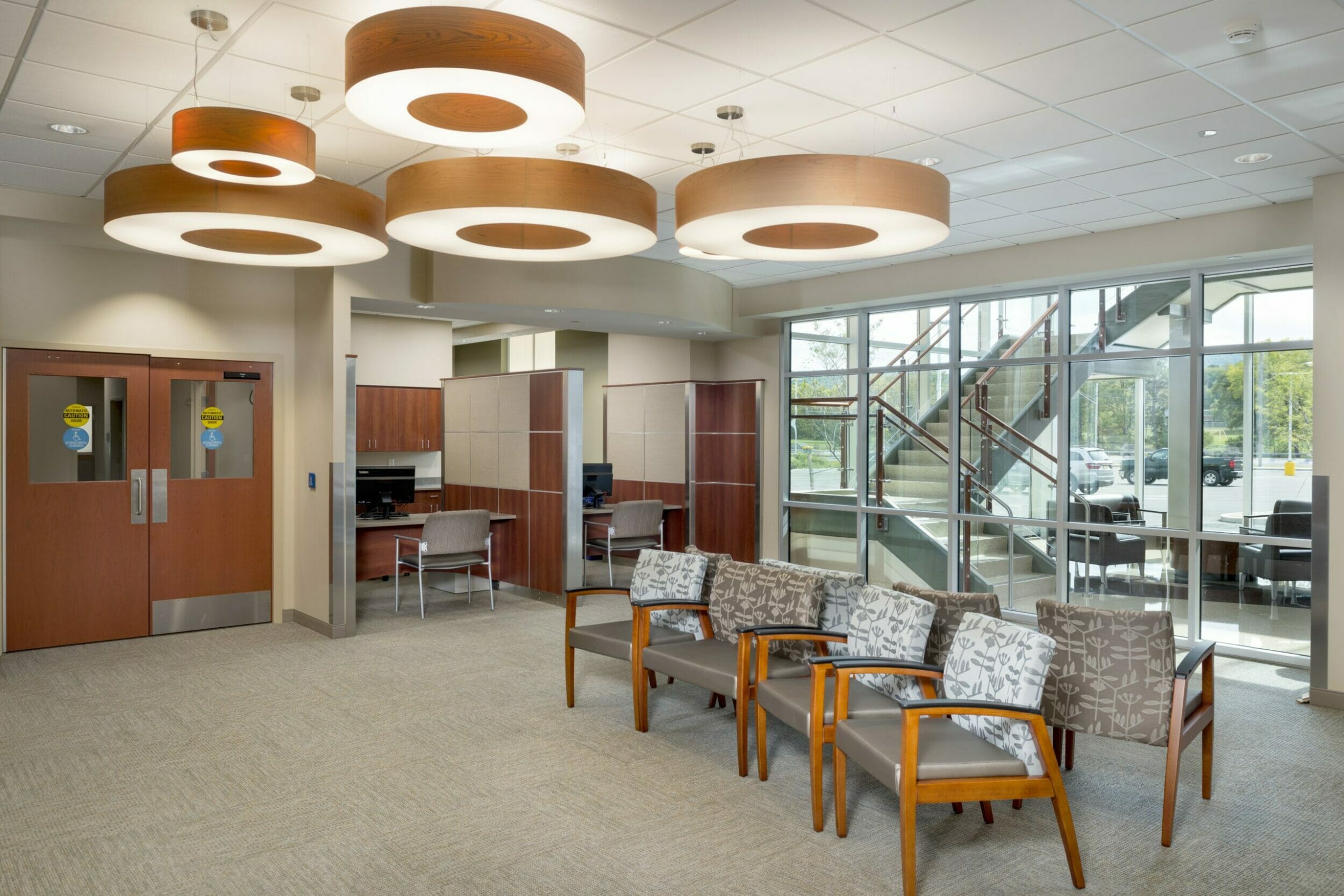 interior lobby/atrium seating area and staircase to upper level